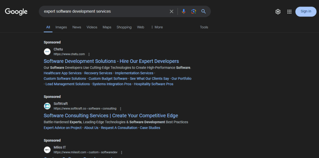 Google SERPS showing sponsored/ paid search ads for “expert software development” search query