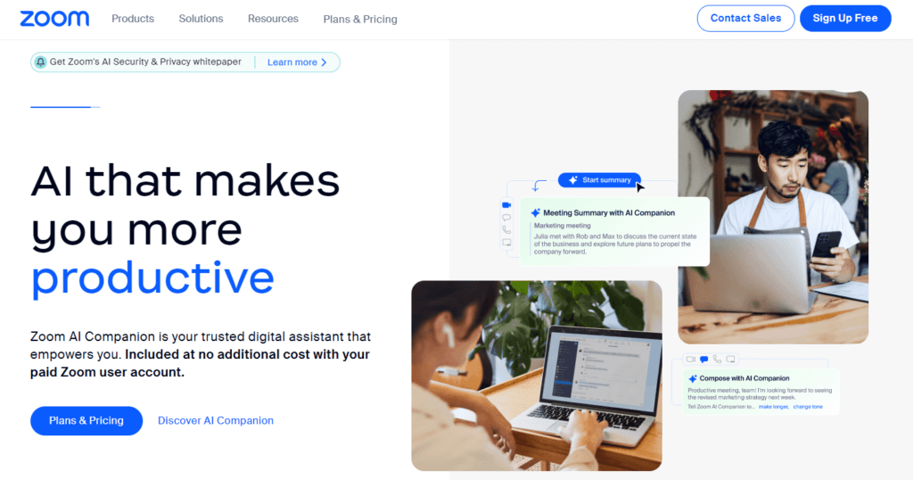 Screenshot from Zoom homepage showing a man working on a laptop and some text explaining how AI can help make you more productive.