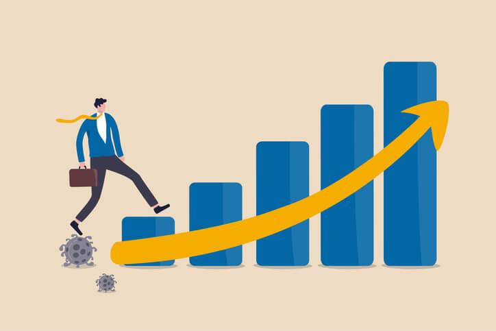 An illustration of a businessman climbing a bar chart, with each bar increasing in height, suggesting taking steps towards business transformation.